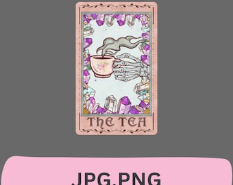 May include: A tarot card with a pink background and a skeleton hand holding a cup of tea. The card is surrounded by crystals and the text "The Tea" is printed on the card.