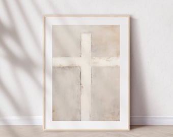 May include: A framed abstract painting of a white cross on a beige background. The cross is centered in the frame and is surrounded by a light beige border.