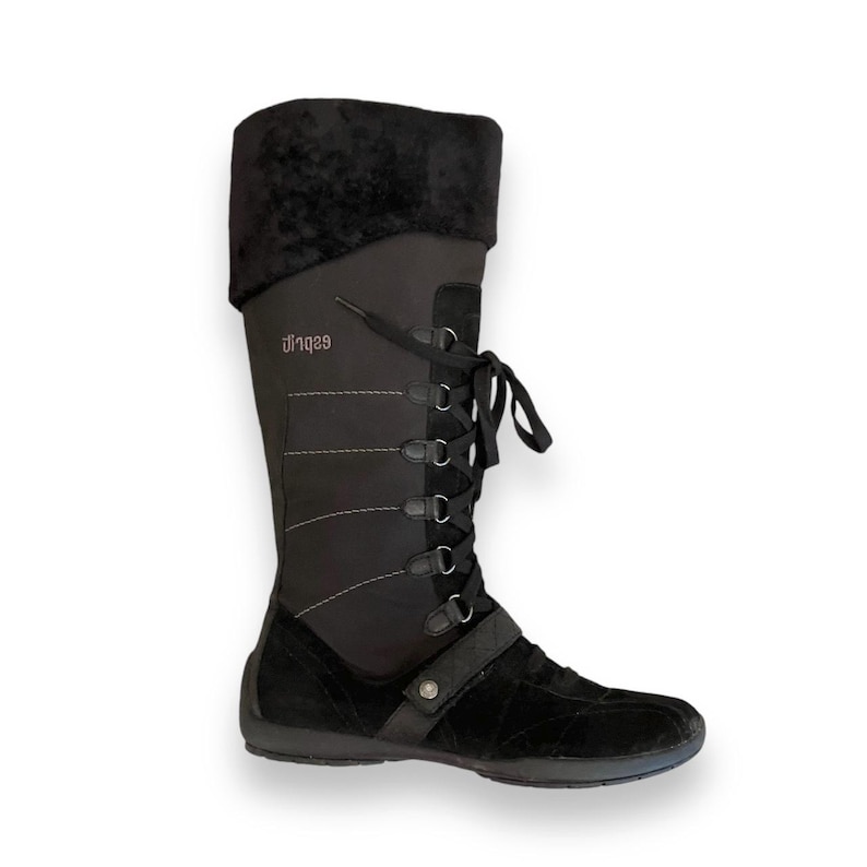 May include: Black suede and nylon lace-up boots with a zipper on the side. The boots have a padded collar and a rubber sole. The brand name "929" is printed on the side of the boot.