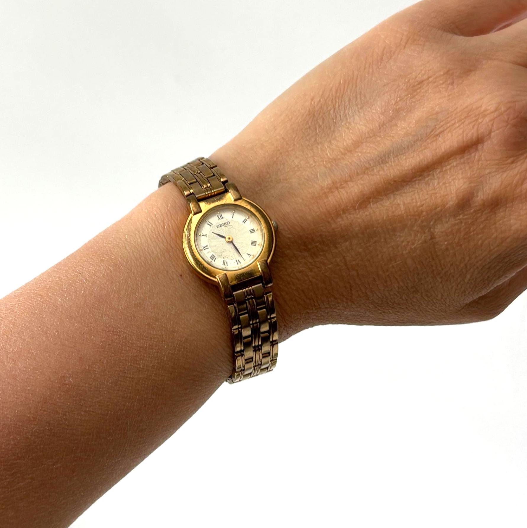 Vintage Seiko Ladies Quartz Watch Working Gold Tone Bracelet Roman Numeral Dial Dress Watch