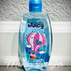 May include: A clear blue bottle of Juicy Cologne with a hot air balloon design. The bottle is 125 ml and says "Up, Up and Away" on the label.