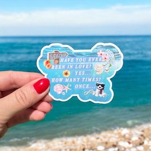 May include: A light blue sticker with a beach theme, featuring text that reads "HAVE YOU EVER BEEN IN LOVE? YES... HOW MANY TIMES? ONCE...". The sticker includes illustrations of a peach, sunflower, seashell, and a dog wearing sunglasses.