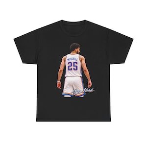 May include: Black t-shirt featuring a basketball player in a white jersey with the number 25 and the name "Mitchell". The jersey has blue and orange accents. The player is seen from the back.