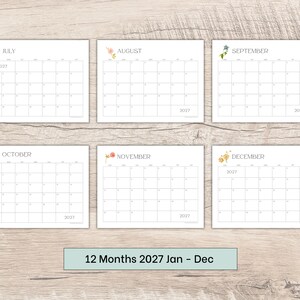 May include: A set of six rectangular calendar pages for the year 2027, covering the months of July through December. Each white page features a grid layout with thin black lines, a floral illustration, and the text 2027 printed on the sheets.