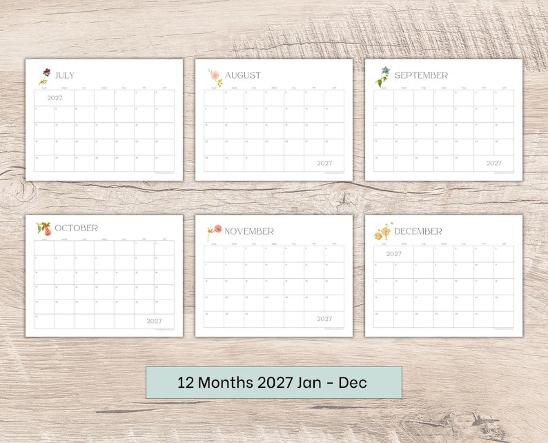 May include: A set of six rectangular calendar pages for the year 2027, covering the months of July through December. Each white page features a grid layout with thin black lines, a floral illustration, and the text 2027 printed on the sheets.