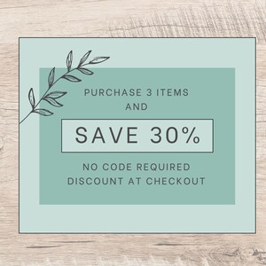 May include: A rectangular sign with a light green background and a darker green central block. It features a black line drawing of a leafy branch and text that reads: PURCHASE 3 ITEMS AND SAVE 30% NO CODE REQUIRED DISCOUNT AT CHECKOUT.