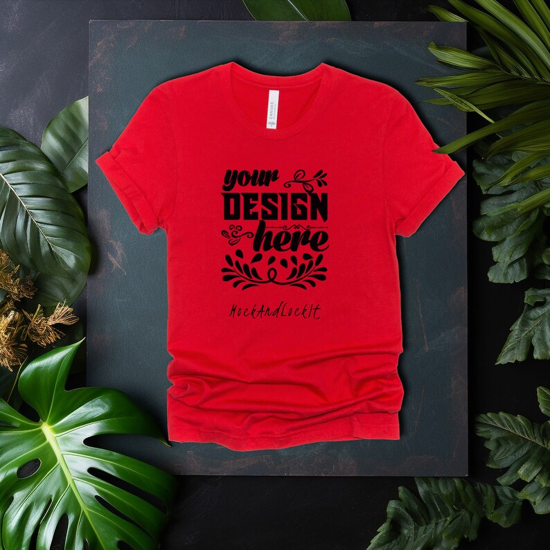 May include: Red t-shirt with a black design that says "your design here" and "RockAndLockIt" in a decorative font.