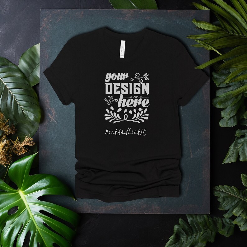May include: Black t-shirt with a white design that says "your design here" and "MockAndLockIt" on a dark green background.