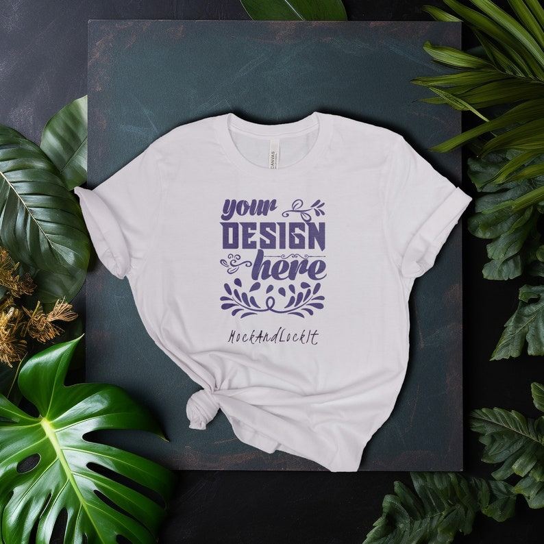 May include: White t-shirt with a purple design that says "your design here" and "MockAndLockIt" below it.