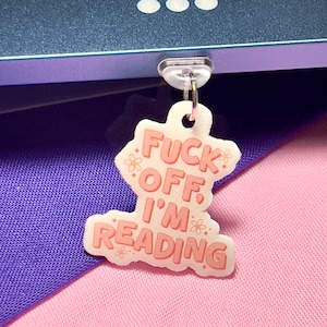 Dra åt helvete, jag läser Kindle-dammpluggar: Bokinspirerad e-läsartillbehör