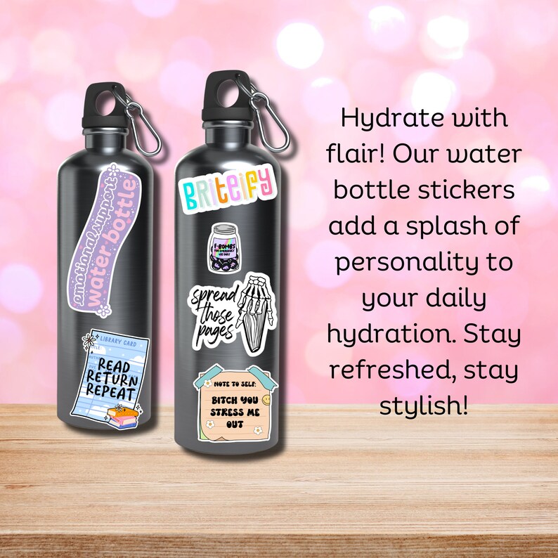 May include: Two silver water bottles with colorful stickers. The stickers feature phrases like "emotional support water bottle", "briteify", "spread those pages", "bitch you stress me out", and "read return repeat".
