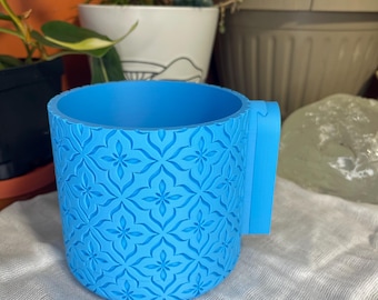 Väggmonterad blomkruka med sammankopplande droppbricka