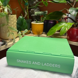 Playbook'D Ormar och stegar - Spel med vikbokstema bild 1