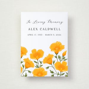May include: A white rectangular memorial card featuring the text In Loving Memory, the name ALEX CALDWELL, and the dates APRIL 17, 1933 - MARCH 5, 2026. The bottom section is decorated with a vibrant illustration of orange California poppy flowers.