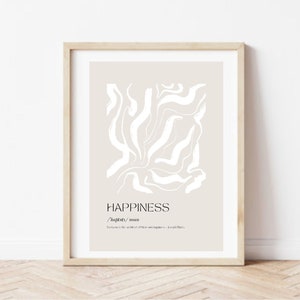 Puede incluir: Una impresión enmarcada con un fondo beige y un diseño abstracto blanco. El texto "HAPPINESS" está impreso en negro en la parte inferior de la impresión, junto con la definición: "/'hæpinəs/ noun:  the state of feeling or showing pleasure and contentment."