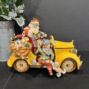 Porcelain Santa On Wheels by Grandeur Noel