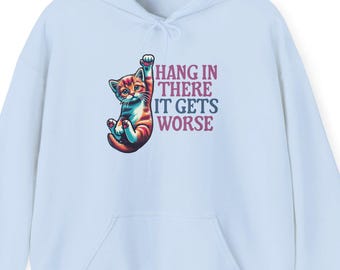 May include: Light blue hoodie with a graphic of a cat hanging upside down and the text "Hang in there it gets worse".