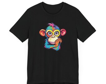 May include: Black t-shirt with a colorful cartoon monkey wearing glasses. The monkey is looking to the right and has its hand on its chin.
