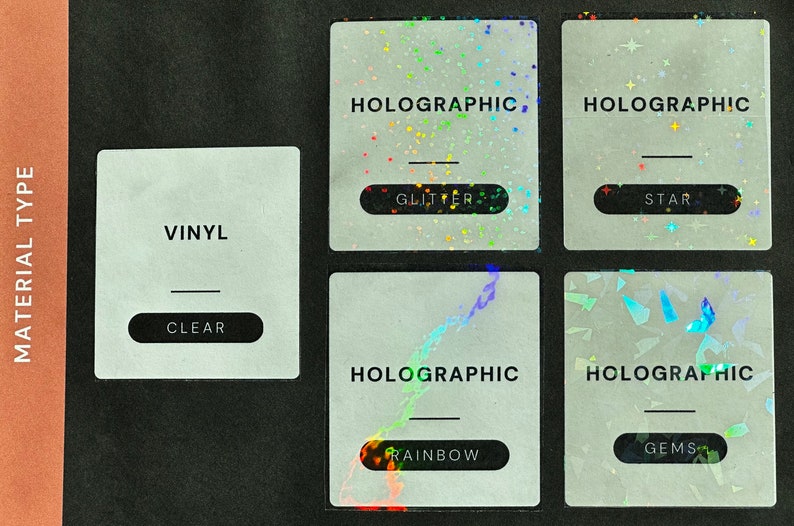 May include: Four vinyl sticker samples with different holographic finishes. The top left sticker says "VINYL" and "CLEAR". The top right sticker says "HOLOGRAPHIC" and "GLITTER". The bottom left sticker says "HOLOGRAPHIC" and "RAINBOW". The bottom right sticker says "HOLOGRAPHIC" and "GEMS".