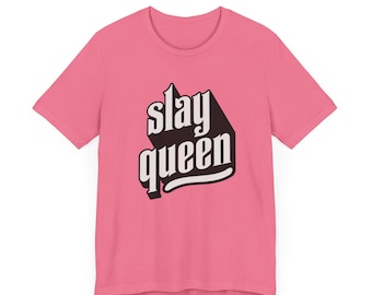 May include: Pink t-shirt with the text "slay queen" in black and white lettering.