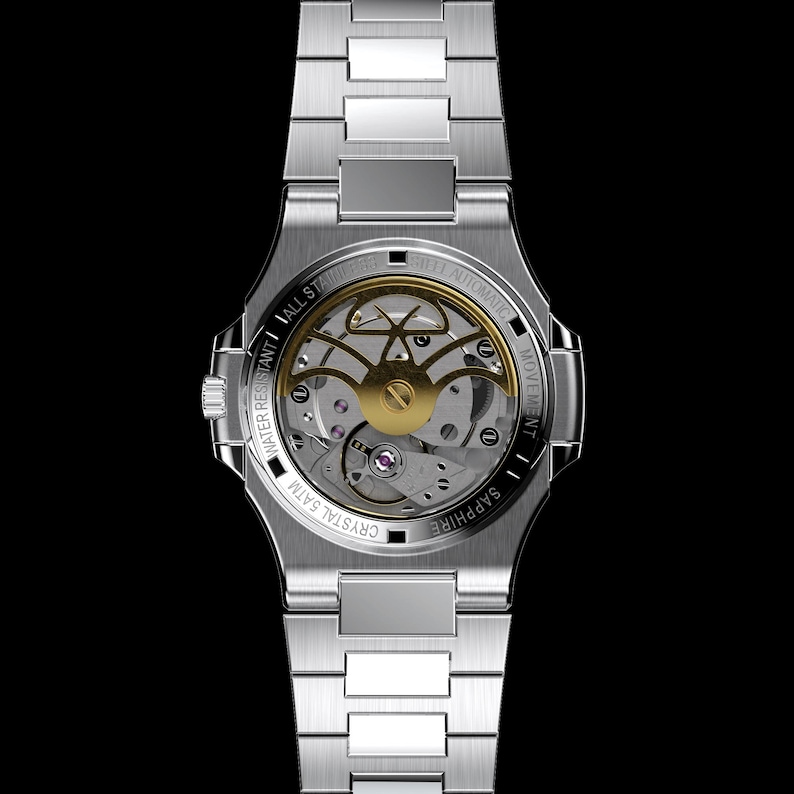 May include: A silver stainless steel wristwatch with a transparent back, showcasing the intricate gold-colored automatic movement. The watch features a silver band and is water-resistant to 5 ATM. The back of the watch is labeled "Sapphire" and "Crystal 5 ATM".