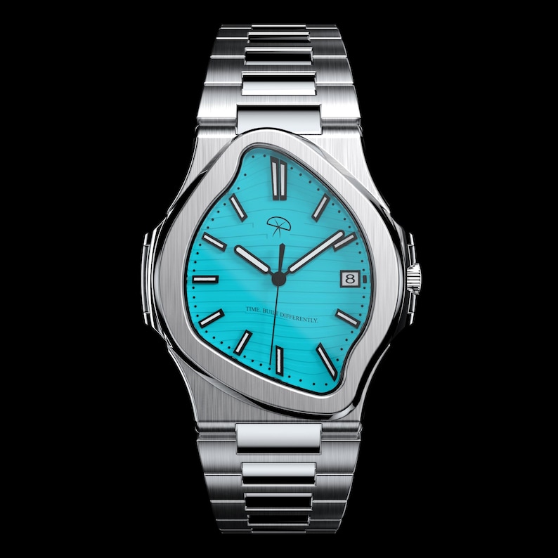 May include: A silver wristwatch with a unique, melted-style case and a turquoise face. The watch features black hands, hour markers, and a date window at the 3 o'clock position. The watch band is made of silver links, and the watch face has the text "TIME BENDS DIFFERENTLY".