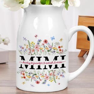 May include: White ceramic pitcher with a floral design and the word "MIMI" with the names "Henry, Jennifer, Sarah, Max" written below.