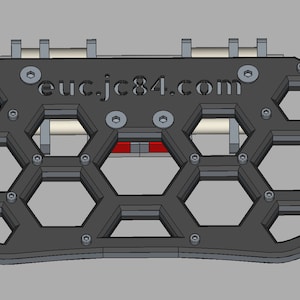 May include: A black and red 3D printed honeycomb design with the text "euc.jc84.com" in the center. The design is made of a series of hexagonal shapes.