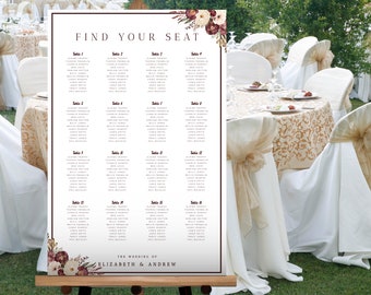 May include: A white wedding seating chart with a burgundy and floral border. The chart is titled "Find Your Seat" and lists the names of guests assigned to each table. The bottom of the chart reads "The Wedding of Elizabeth & Andrew".