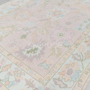 Hand Knotted Wool Oushak Rug: Pink & Blue Turkish Inspired Design