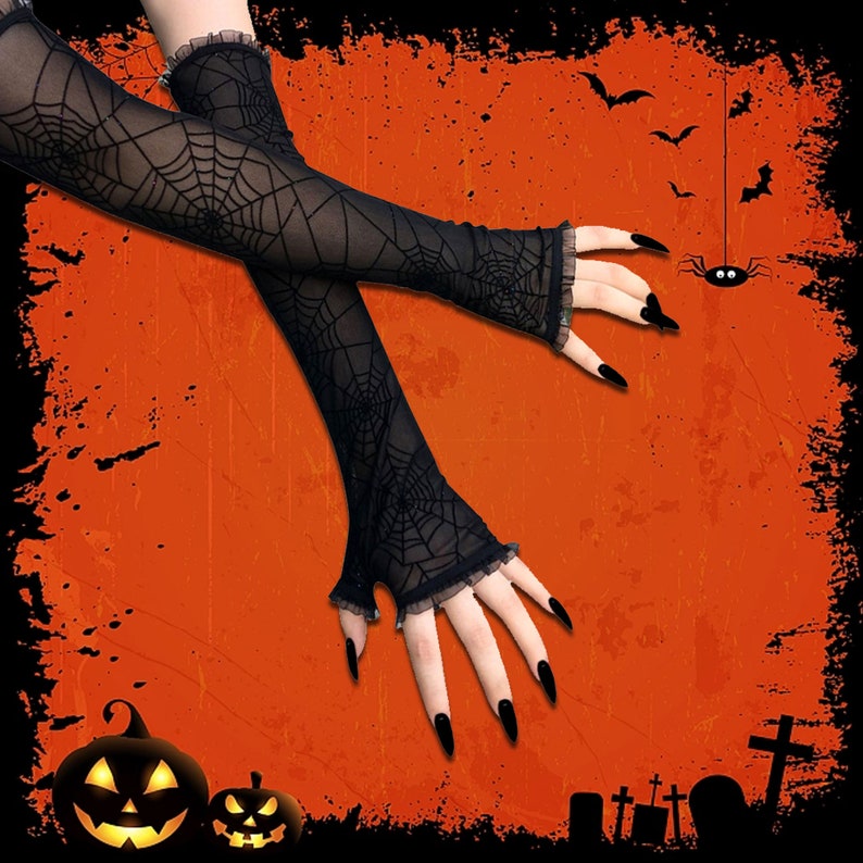 May include: A pair of black sheer fingerless gloves with a spiderweb pattern. The gloves are on a hand with long, black fingernails.