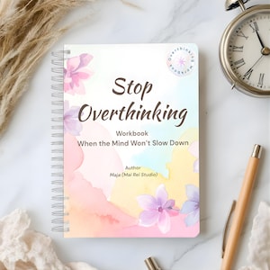 May include: A spiral-bound workbook titled "Stop Overthinking" with floral watercolor accents. The cover features the text "Workbook: When the Mind Won't Slow Down" and the author's name, Maja (Mai Rei Studio). An alarm clock and pen are also visible.