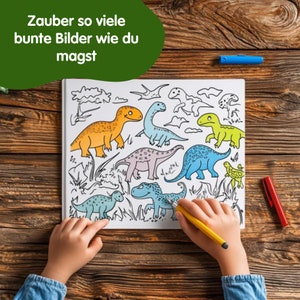 May include: A child's hand colors a dinosaur coloring book with yellow, orange, green, blue, and purple dinosaurs. The book has the text "Zauber so viele bunte Bilder wie du magst" on the cover.