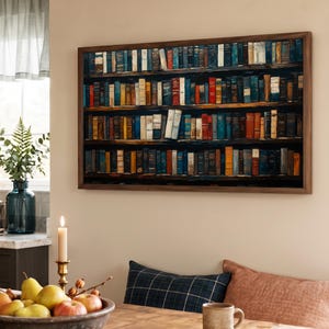 May include: A rectangular wall art piece featuring a detailed print of a multi-tiered wooden bookshelf filled with numerous books in various colors including blue, red, yellow, and white, all enclosed within a dark brown wooden frame.