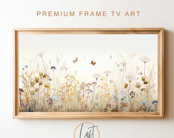 May include: A framed print of a watercolor painting depicting a field of wildflowers with butterflies. The flowers are in shades of beige, brown, yellow, and blue. The butterflies are orange and brown.