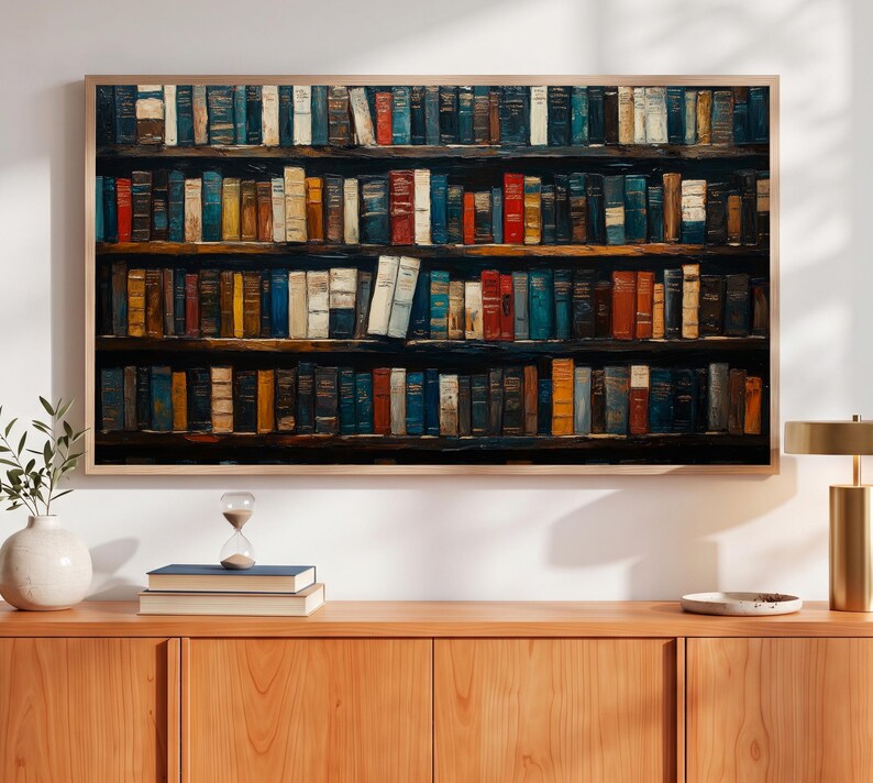 May include: A rectangular wall art print featuring a detailed illustration of four wooden shelves densely packed with numerous hardcover books in various colors including blue, red, yellow, brown, and white, all displayed in a light wood frame.