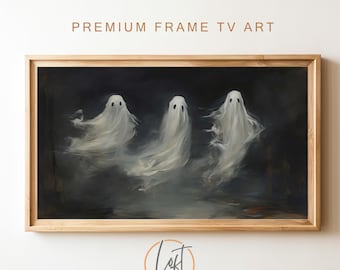 May include: A rectangular wooden frame containing digital art of three white, translucent ghosts floating against a dark, smoky background. The text PREMIUM FRAME TV ART is printed in brown above the frame, and a circular logo is below.