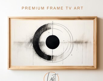 May include: Black and white abstract art print in a wooden frame. The print features a circle with a smaller black circle in the center. The circle is surrounded by concentric circles and lines.