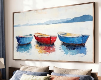 May include: A rectangular oil painting in a brown frame depicting three small boats floating on calm water. The boats are colored blue, red, and blue from left to right. The background features a pale sky and distant blue mountains.
