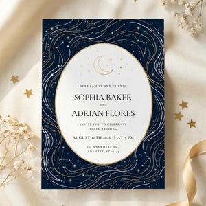 May include: Navy blue wedding invitation with gold constellation and moon design. The invitation includes the names Sophia Baker and Adrian Flores, and the wedding date, August 20th, 2026, at 5 PM.