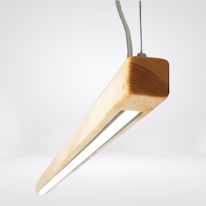 May include: A wooden pendant light with a rectangular shape and a white LED light strip. The light is suspended from the ceiling by a thin wire.