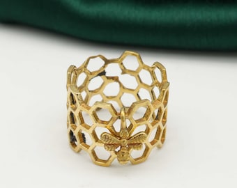 Messing honingraatring: geometrische bijensieraden,