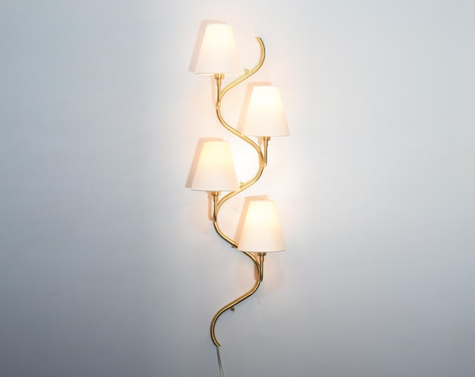 The Gold Brass wall sconce — where sophistication meets light.