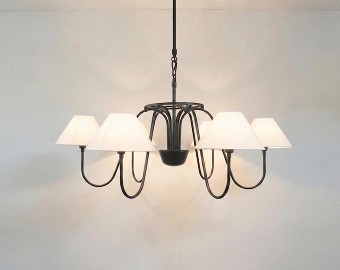 The Matte Black chandelier captures a balance of power, beauty, and serenity.