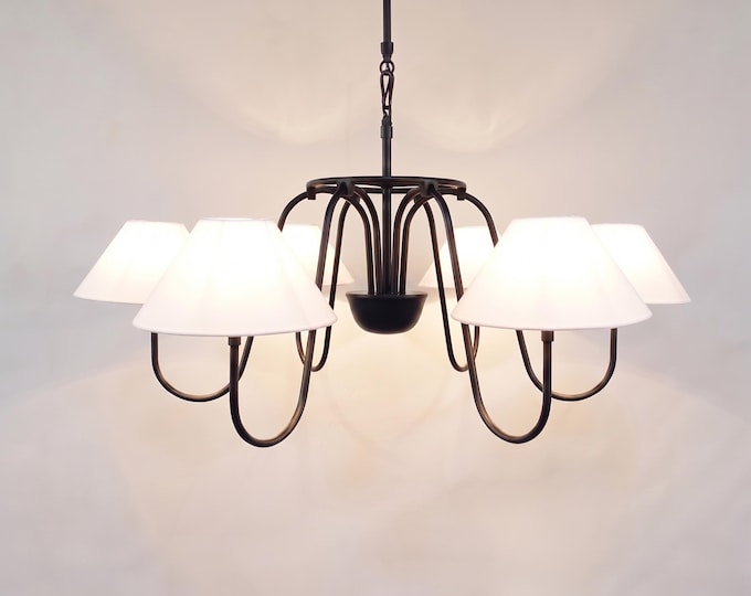 The Matte Black chandelier captures a balance of power, beauty, and serenity.
