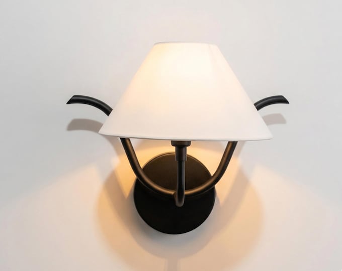 Elevate your interiors with the bold presence of matte black lighting.