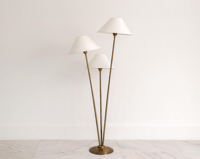 Enchanting Glow: The Brown Triple Shade Floor Lamp