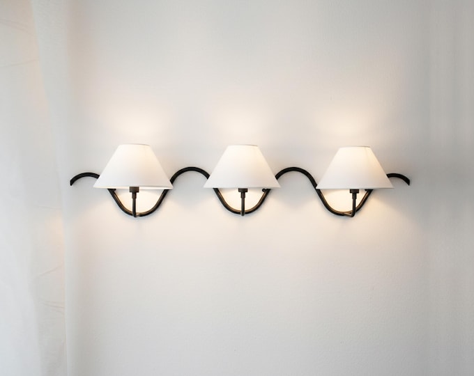 The epitome of modern elegance — a matte black wall sconce that captivates.