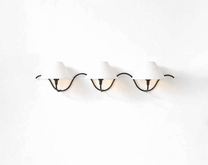 The epitome of modern elegance — a matte black wall sconce that captivates.