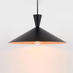 May include: A matte black pendant light fixture featuring a wide, conical shade with a smooth exterior and a warm, light-colored interior. The lamp is suspended by a thin cord and includes a single exposed light bulb centered underneath.